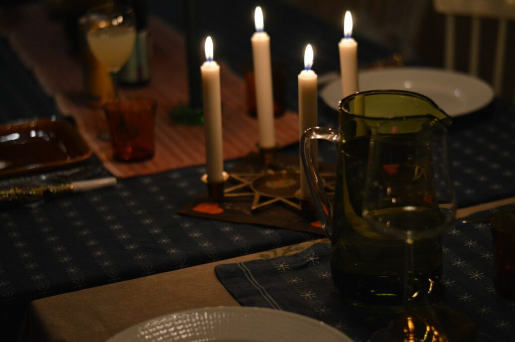 Candles lit on a dinner table
