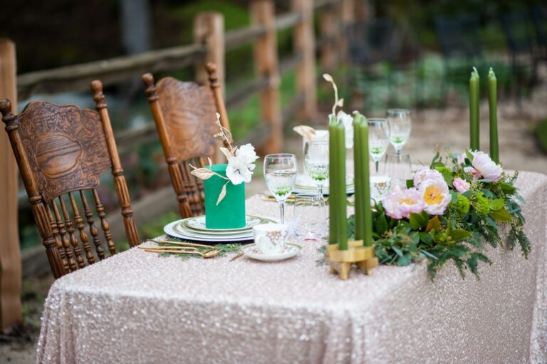 Outdoor table set for two with candles and flowers